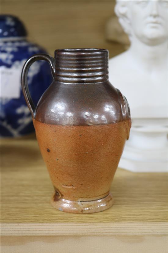 A GI stoneware jug, a Doulton jug and two others 8cm - 22cm